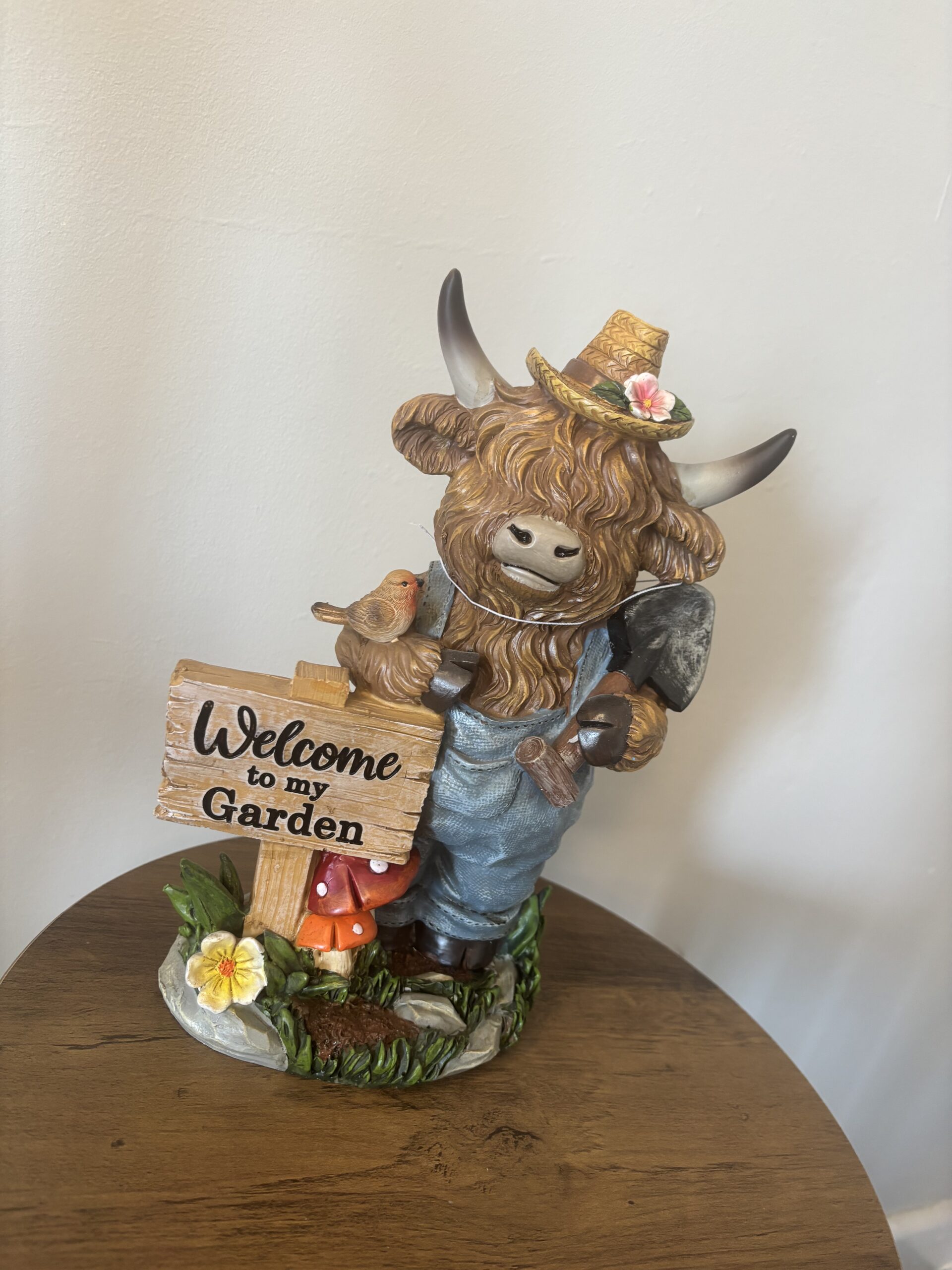 welcome to my garden highland cow